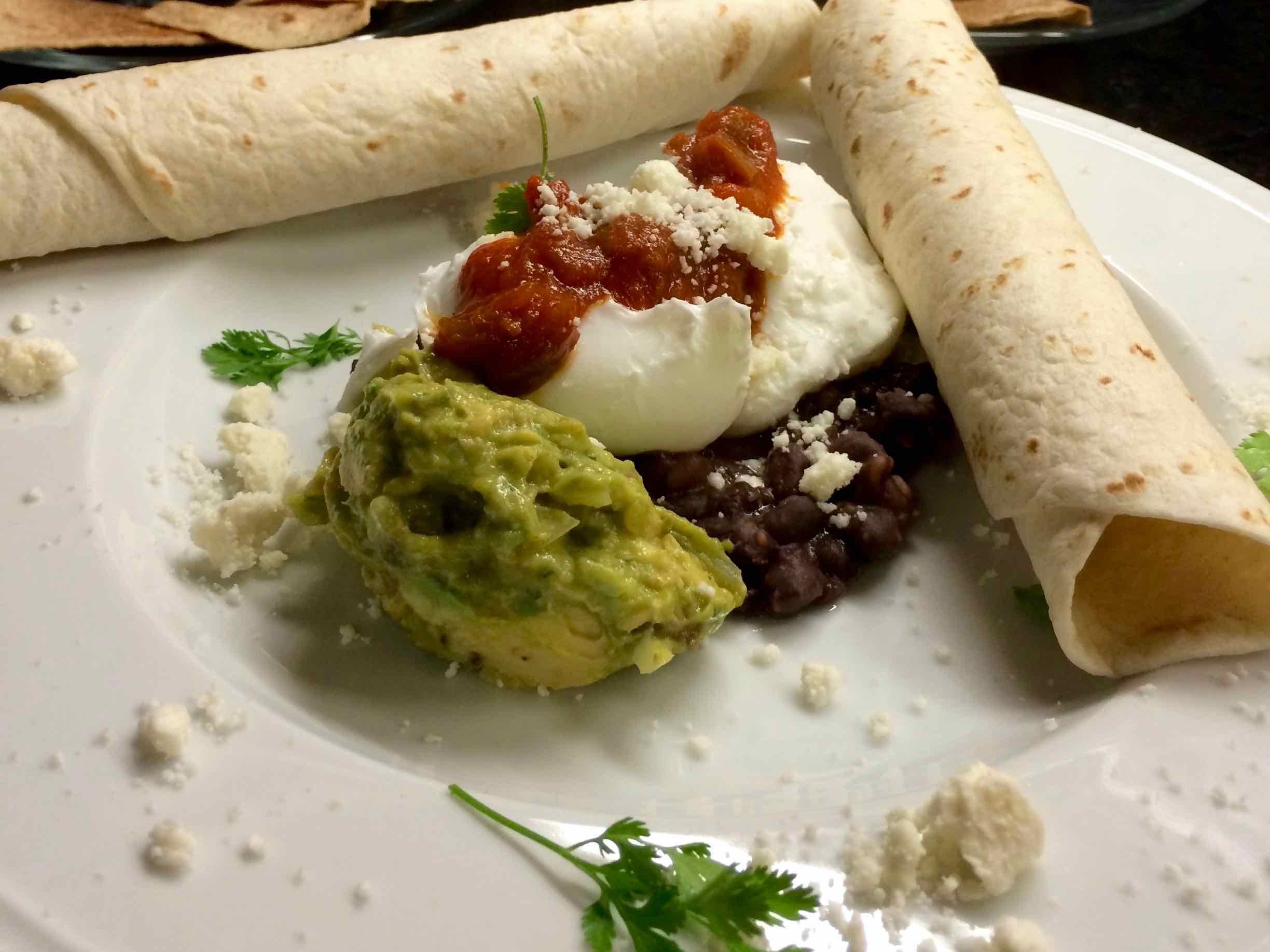 Breakfast at Coach Stop Inn – Huevos rancheros poached eggs with guacamole and salsa