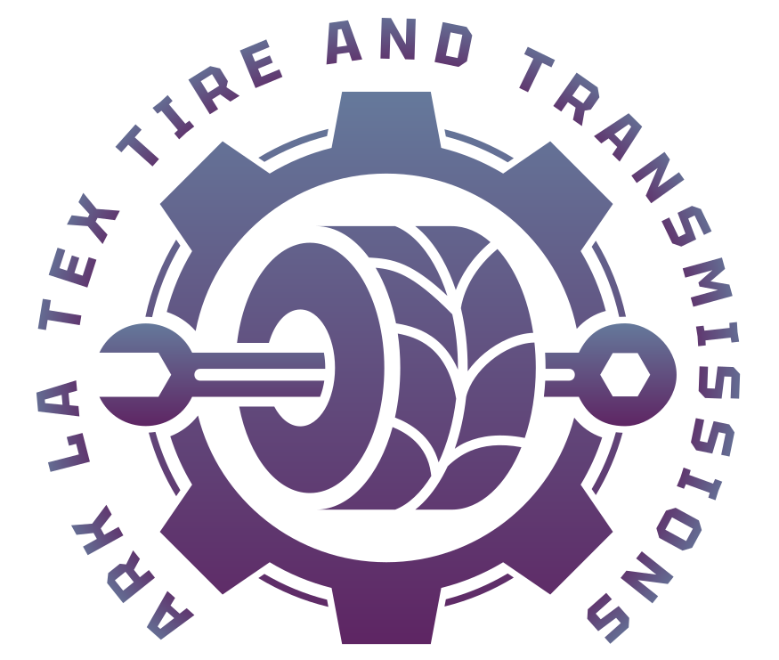 Logo for Ark Tex Tire and Transmissions: tire and wrench inside a gear, with text "Ark Tex Tire and Transmissions."