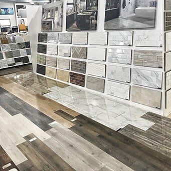 A showroom filled with lots of tiles and wood floors.