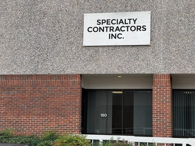 a building with a sign that says specialty contractors inc.