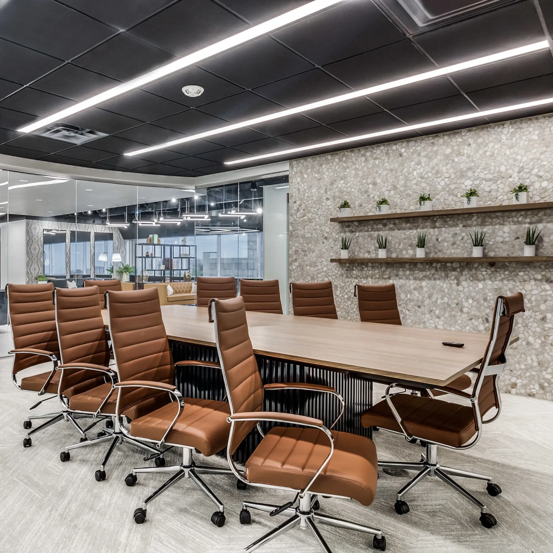 A conference room with a long table and chairs