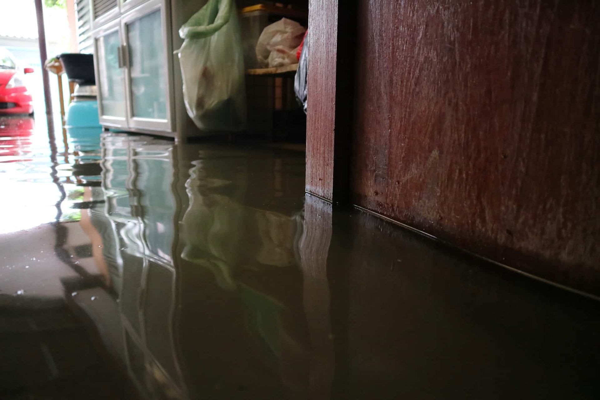 a flooded room with a lot of water on the floor .