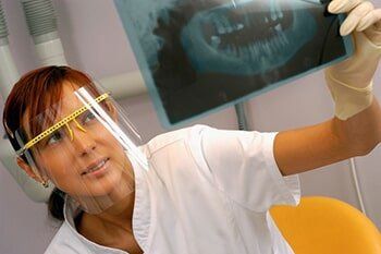 Looking at xray - Dentist care in KY, USA