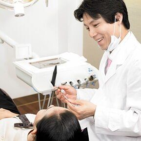 Dentist treating patient - Dentist care in KY, USA