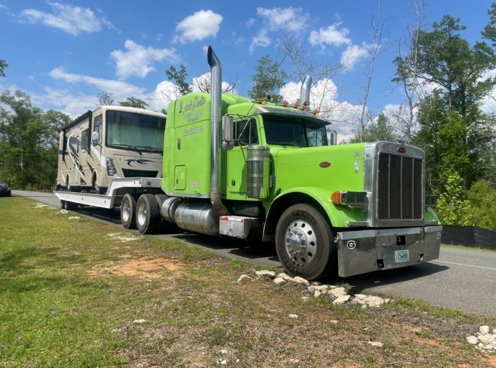 Tow truck with camper on it 