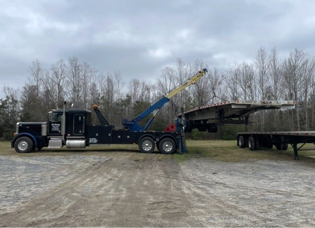 Tow truck moving materials 