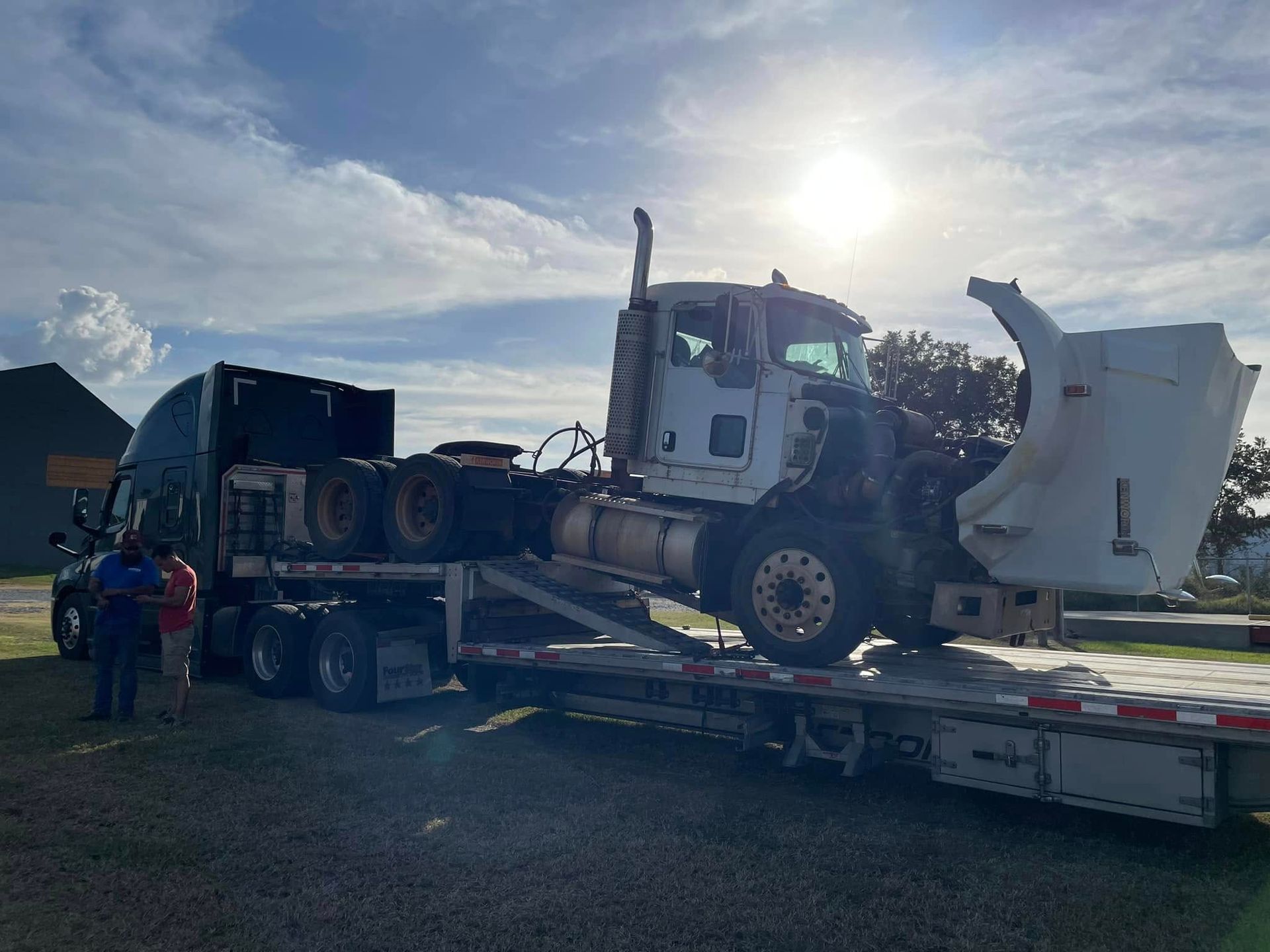 Trailer with truck on it 