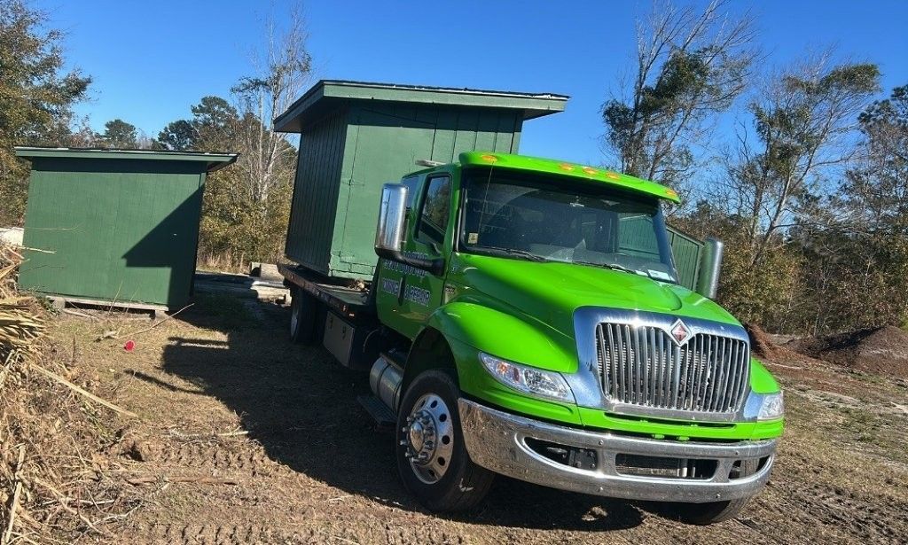 Tow truck with dumpster on it 