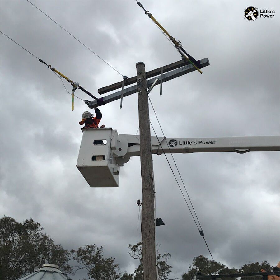 Electrician Repairing A Cable On A Post — Little’s Power in Orange, NSW