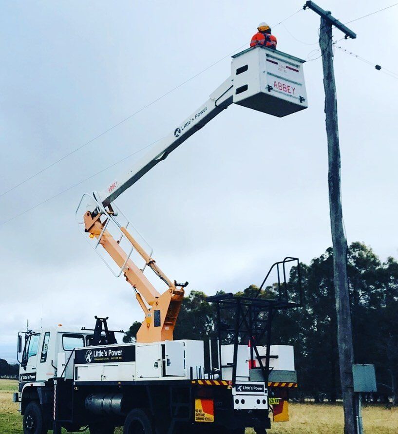 Electrician Inspecting Power Line — Electrical Services in Orange, NSW