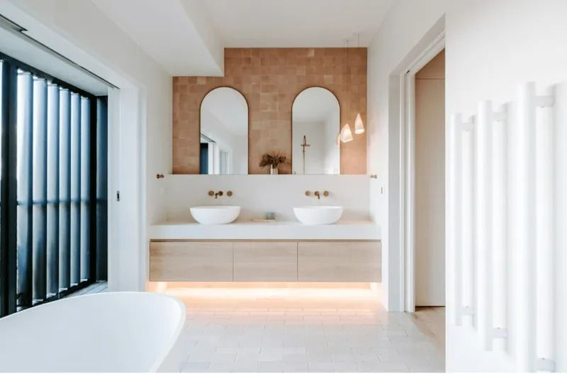 A Bathroom With Two Sinks and a Bathtub — Bruce Smith Cabinets in Bray Park, NSW