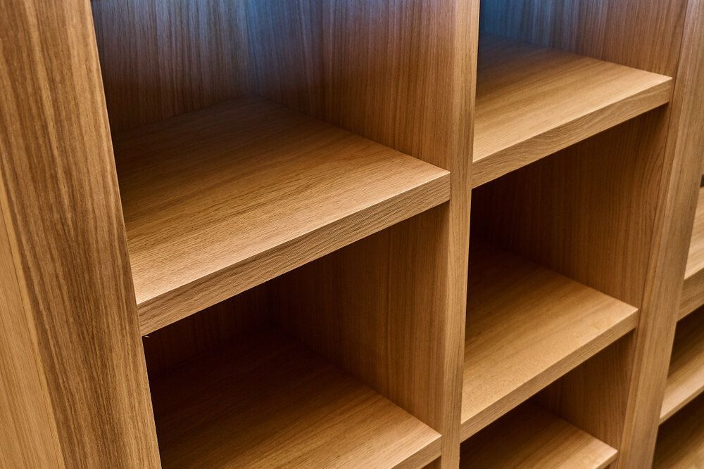 A Close Up of a Wooden Shelf With Empty Shelves — Bruce Smith Cabinets in Bray Park, NSW