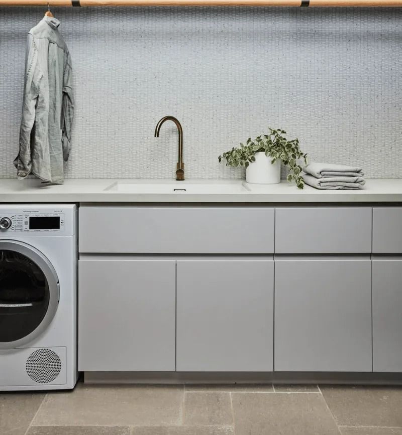A Laundry Room With a Washer and Dryer and a Sink — Bruce Smith Cabinets in Bray Park, NSW