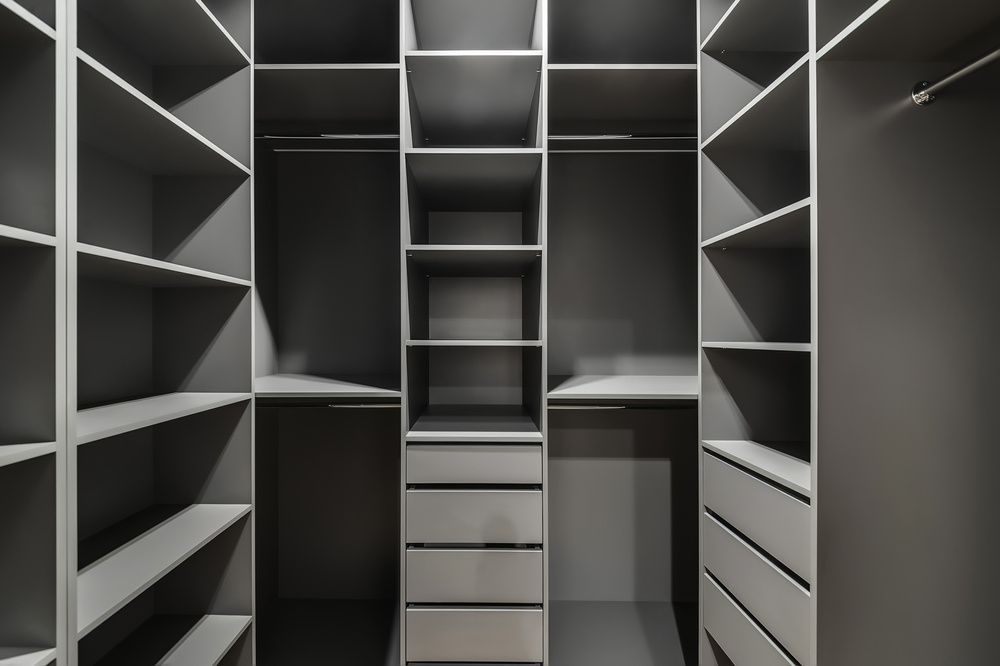 A Walk in Closet With Lots of Shelves and Drawers — Bruce Smith Cabinets in Tweed Heads, NSW