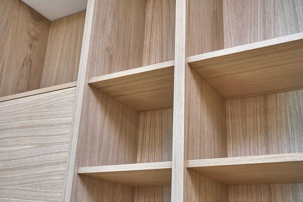 A Close Up of a Wooden Shelf in a Closet — Bruce Smith Cabinets in Bray Park, NSW