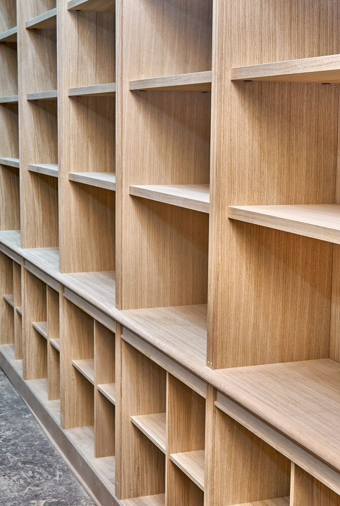 A Row of Empty Wooden Shelves in a Room — Bruce Smith Cabinets in Bray Park, NSW