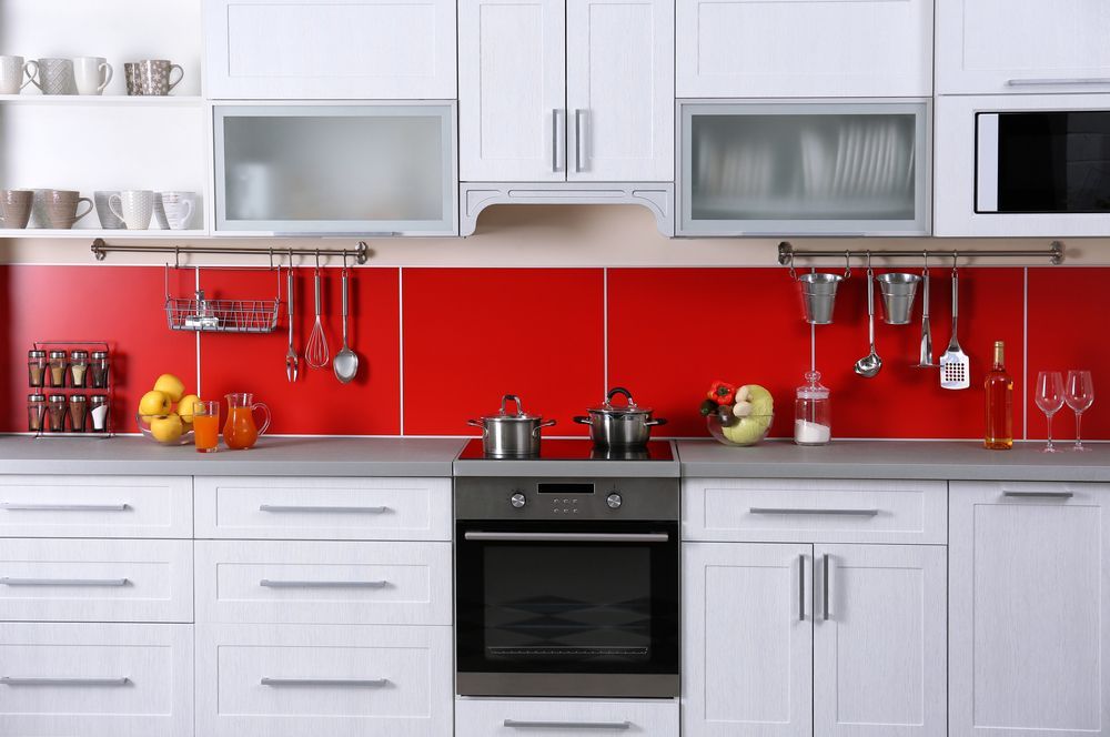 A Kitchen With White Cabinets and Red Tiles — Bruce Smith Cabinets in Mullumbimby, NSW