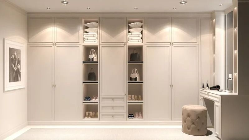A Large Walk in Closet With Lots of Shelves and a Dressing Table — Bruce Smith Cabinets in Bray Park, NSW