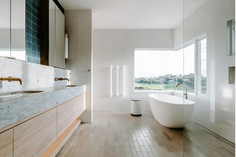A Bathroom With Two Sinks and a Bathtub — Bruce Smith Cabinets in Bray Park, NSW