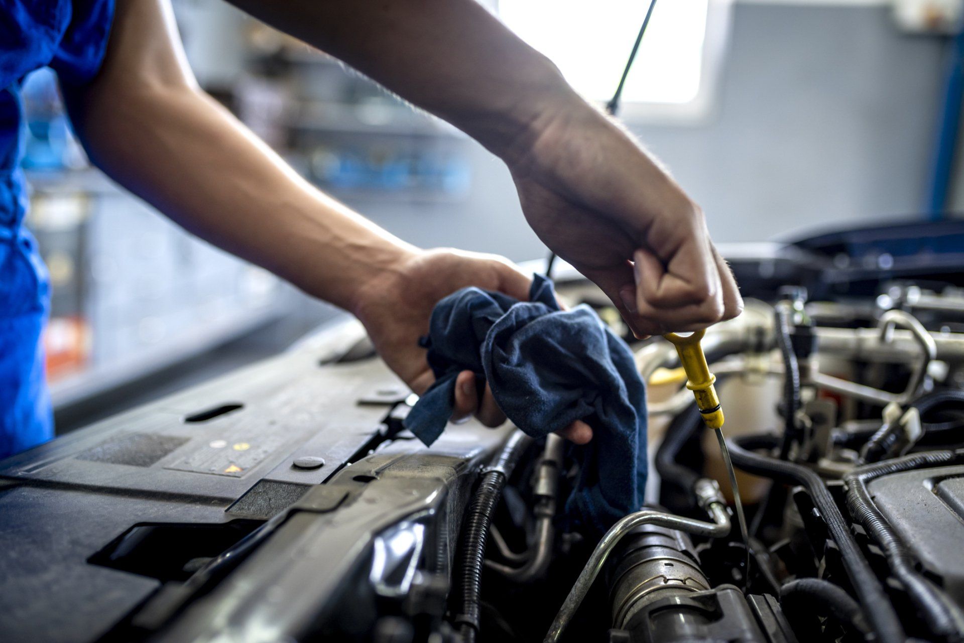 Checking Oil in Car Engine - Burlington, VT - Handy's Service Center