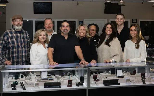 Close-up of a woman trying on a diamond ring, at a jewelry store. - Staples Jewelry | Louisville, KY