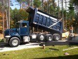 Truck Pouring Asphalt On Road — Porter Corners, NY — Adirondack Paving