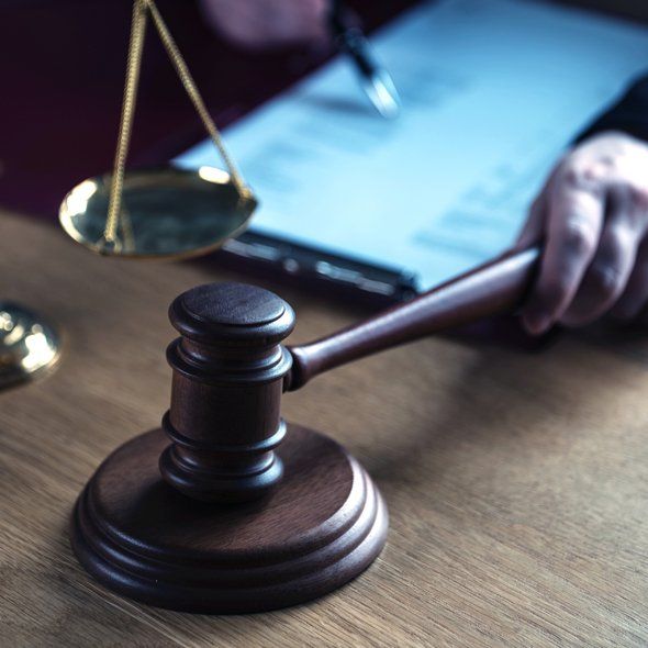 Lawyer Reading Documents — Jacksonville, FL — The Law Office Of Gerald Wilkerson PA Lawyer Reading Documents — Jacksonville, FL — The Law Office Of Gerald Wilkerson PA