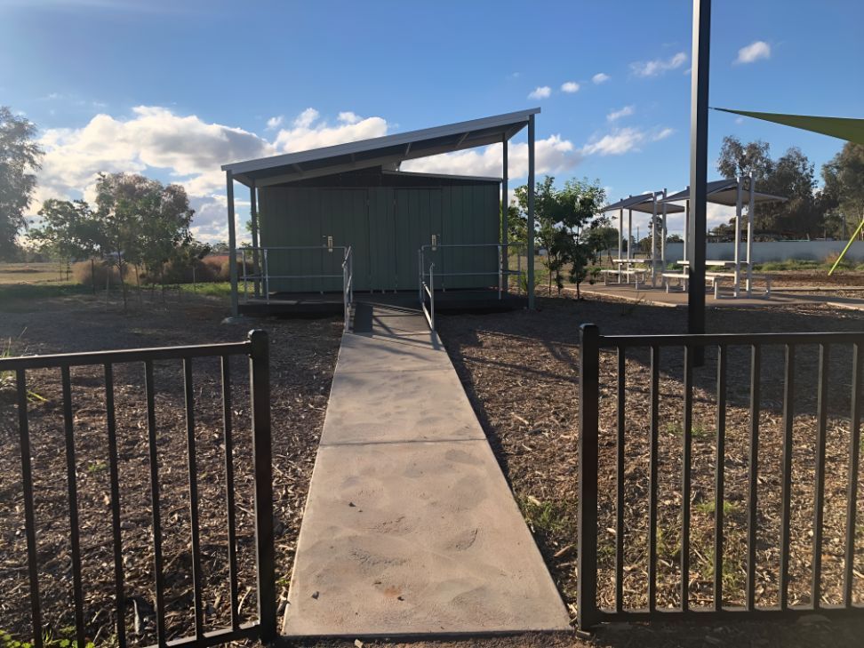 A Concrete Walkway Leading to a Green Building — OSM Transportables In Nyngan, NSW