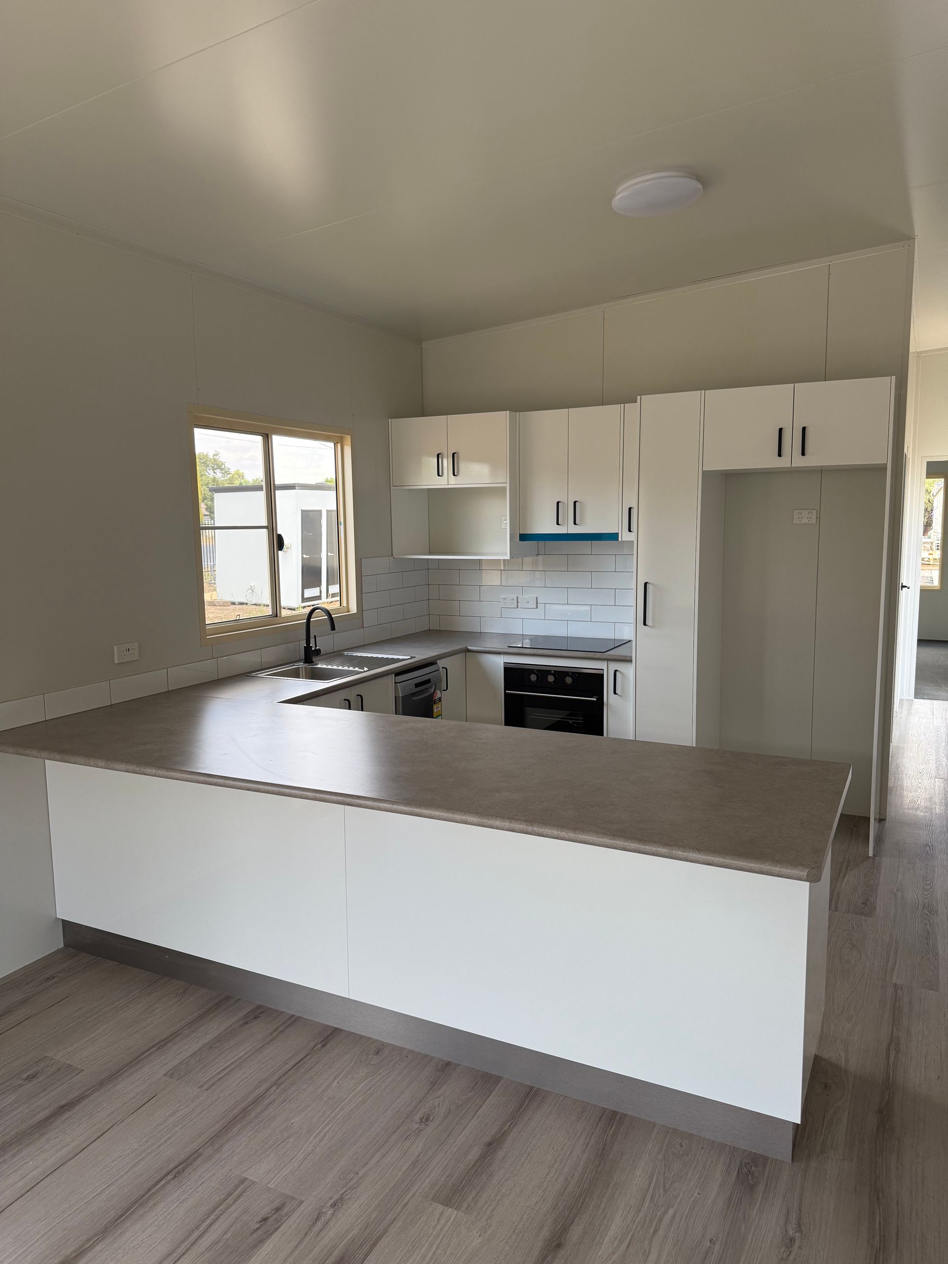 Modern Kitchen With a U-shaped Island — OSM Transportables In Dubbo, NSW