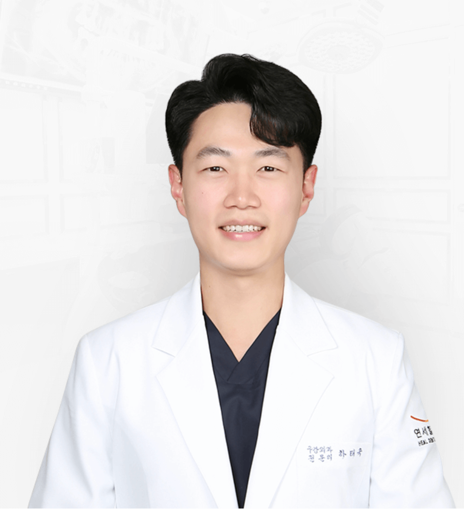 Smiling Asian doctor in a white coat.