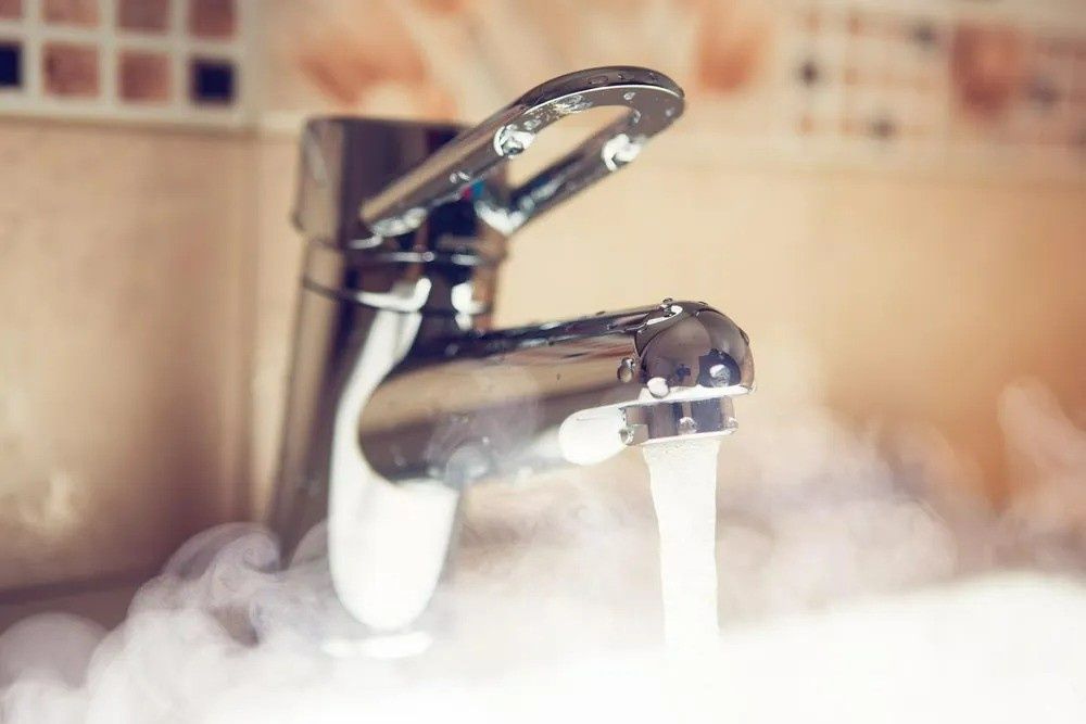 Chrome Faucet Dispensing Hot Water, Creating Steam — VR Marsden Plumbing in Red Rock, NSW