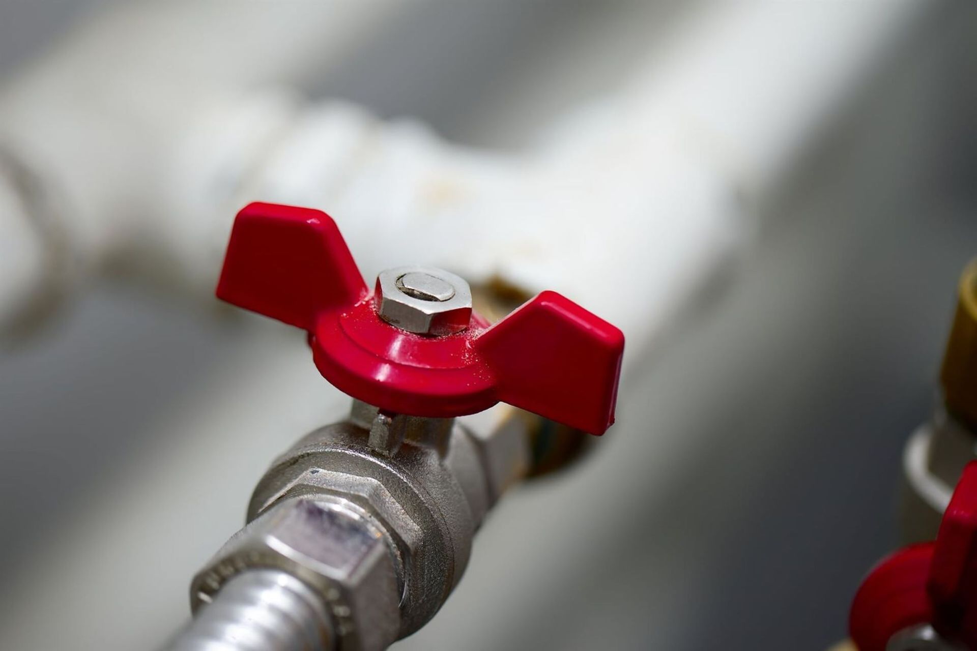 Red Butterfly Valve on a Metal Pipe — VR Marsden Plumbing in Red Rock, NSW