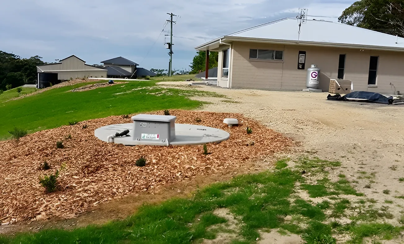 A Tan House With an Outdoor Septic System — VR Marsden Plumbing in Red Rock, NSW
