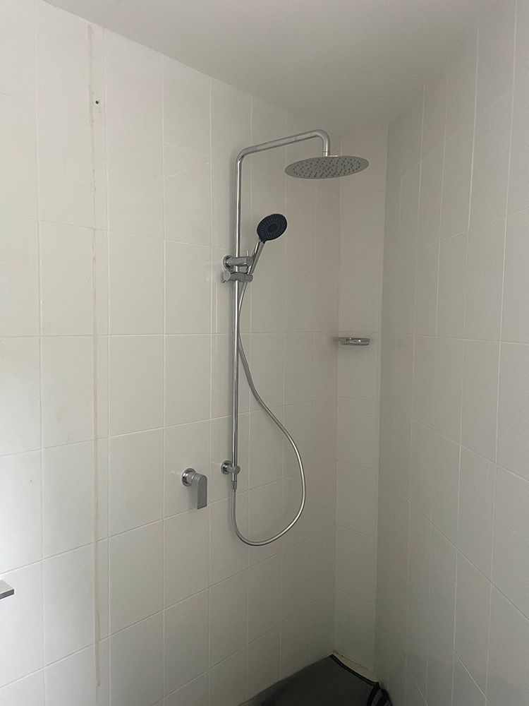 Shower With a Rain Showerhead and Handheld Sprayer on White Tiled Wall — VR Marsden Plumbing in Red Rock, NSW