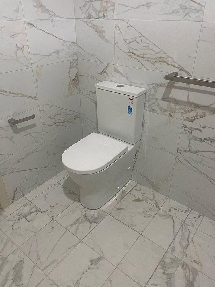 Modern White Bathroom With Shower, and Floating Sink — VR Marsden Plumbing in Corindi Beach, NSW