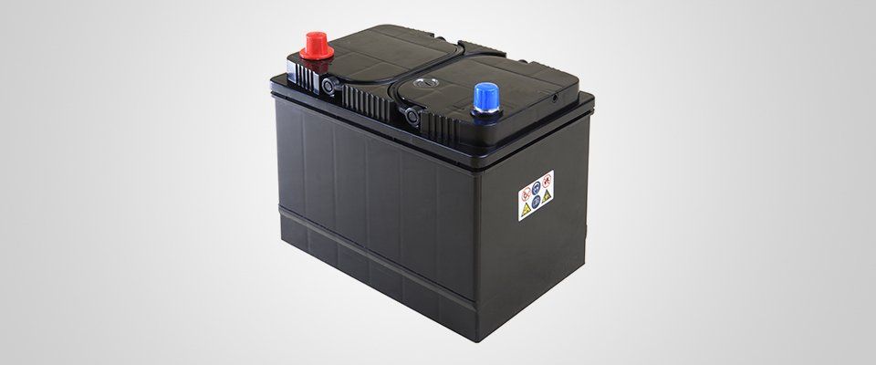 new car battery with blue and red terminal covers