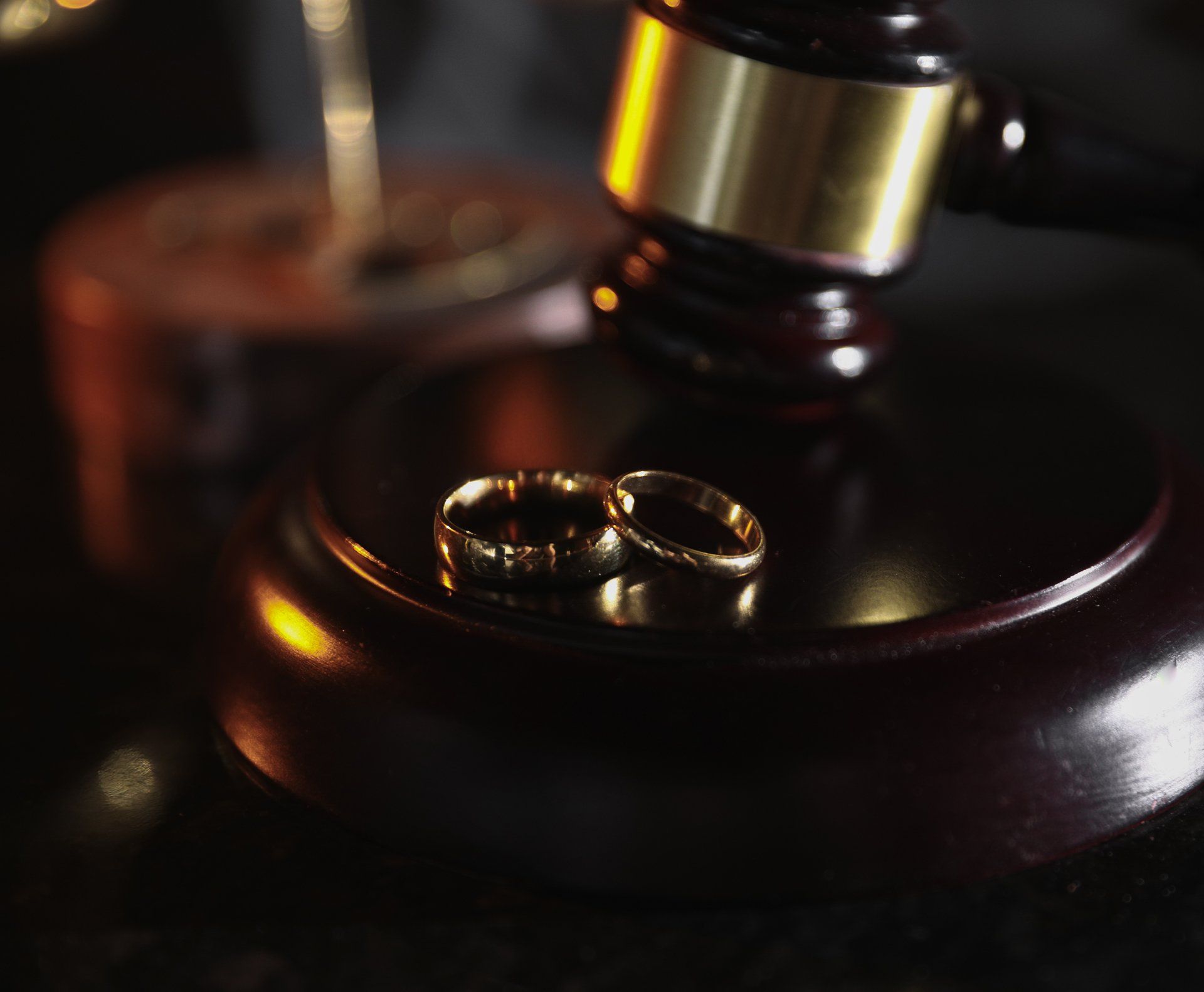 A Gavel With Wedding Rings