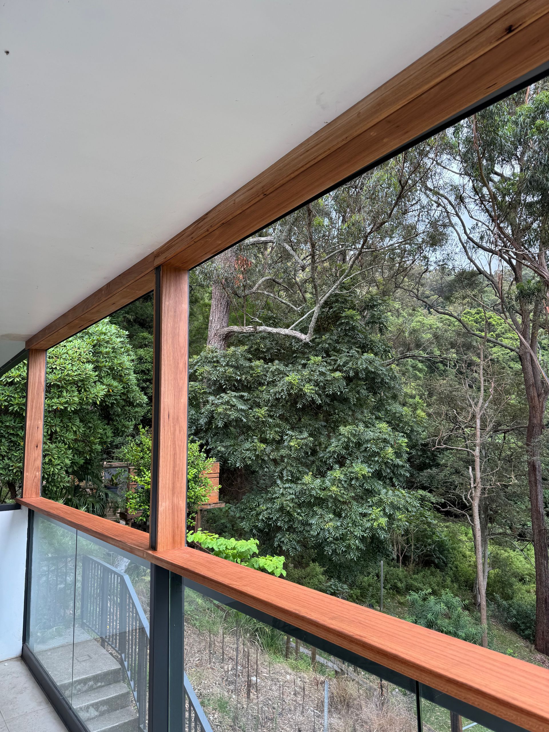 Wooden Framing on balcony with view of trees - Hart Projects Wollongong In Dapto, NSW