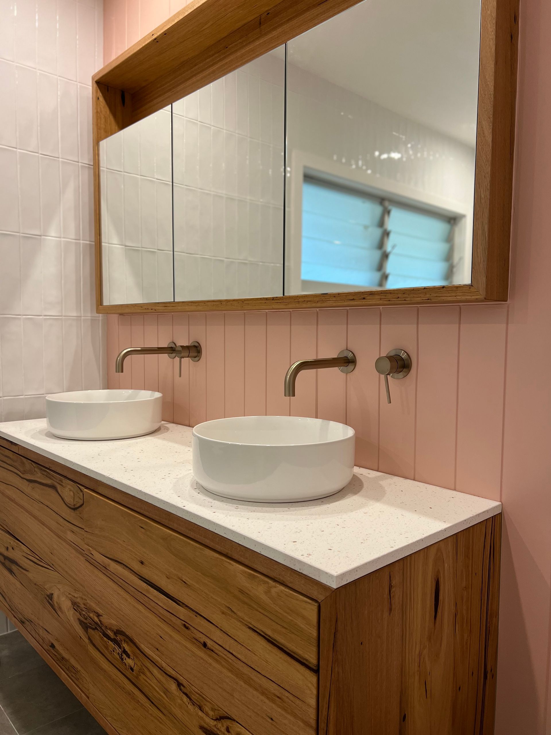 A Bathroom With Two Sinks and a Large Mirror — Hart Projects Wollongong In Kiama, NSW