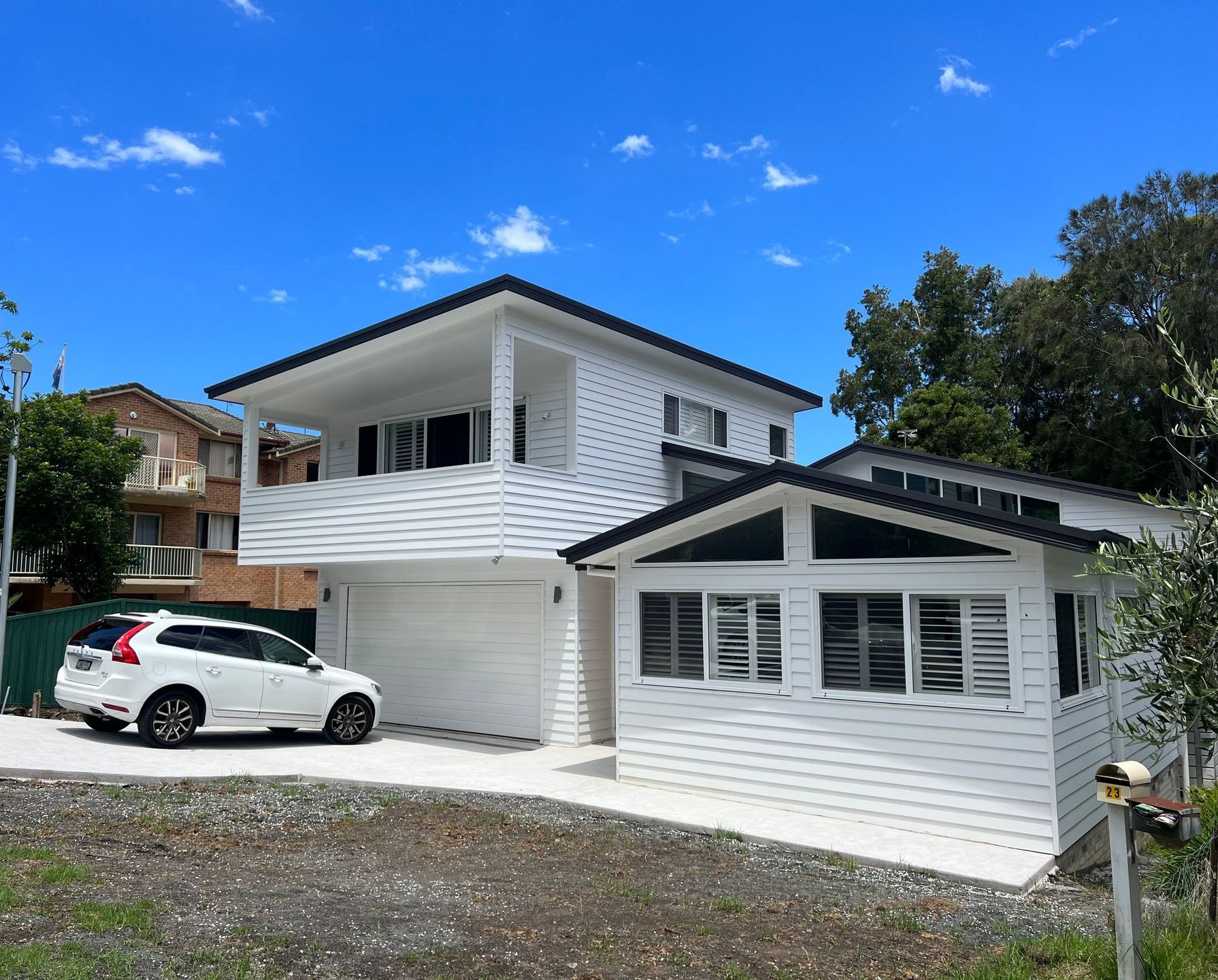 Modern House with White Car in Front  — Hart Projects Wollongong In Dapto, NSW