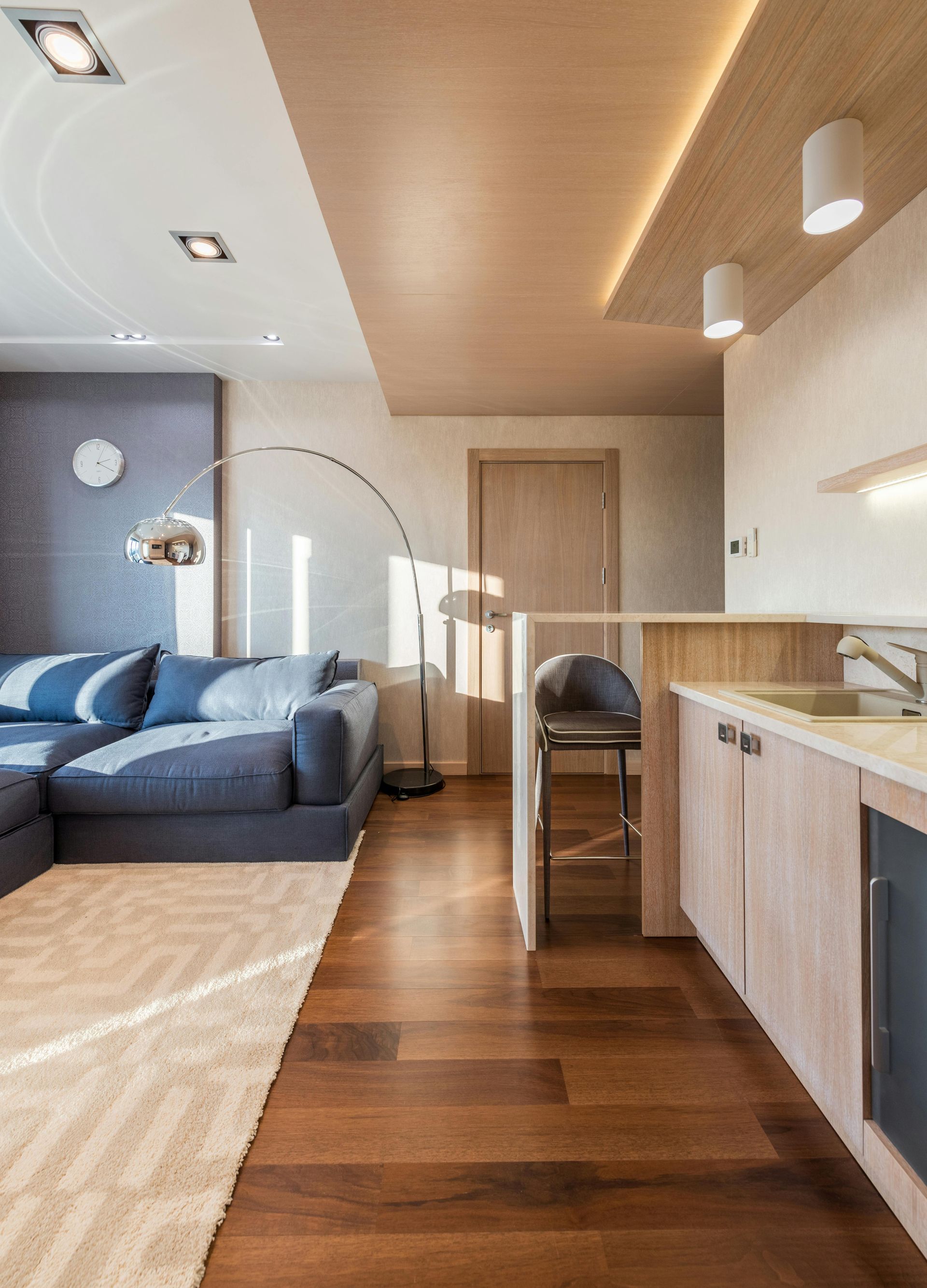 Modern Living Space with lamp and blue lounge — Hart Projects Wollongong In Shellharbour, NSW