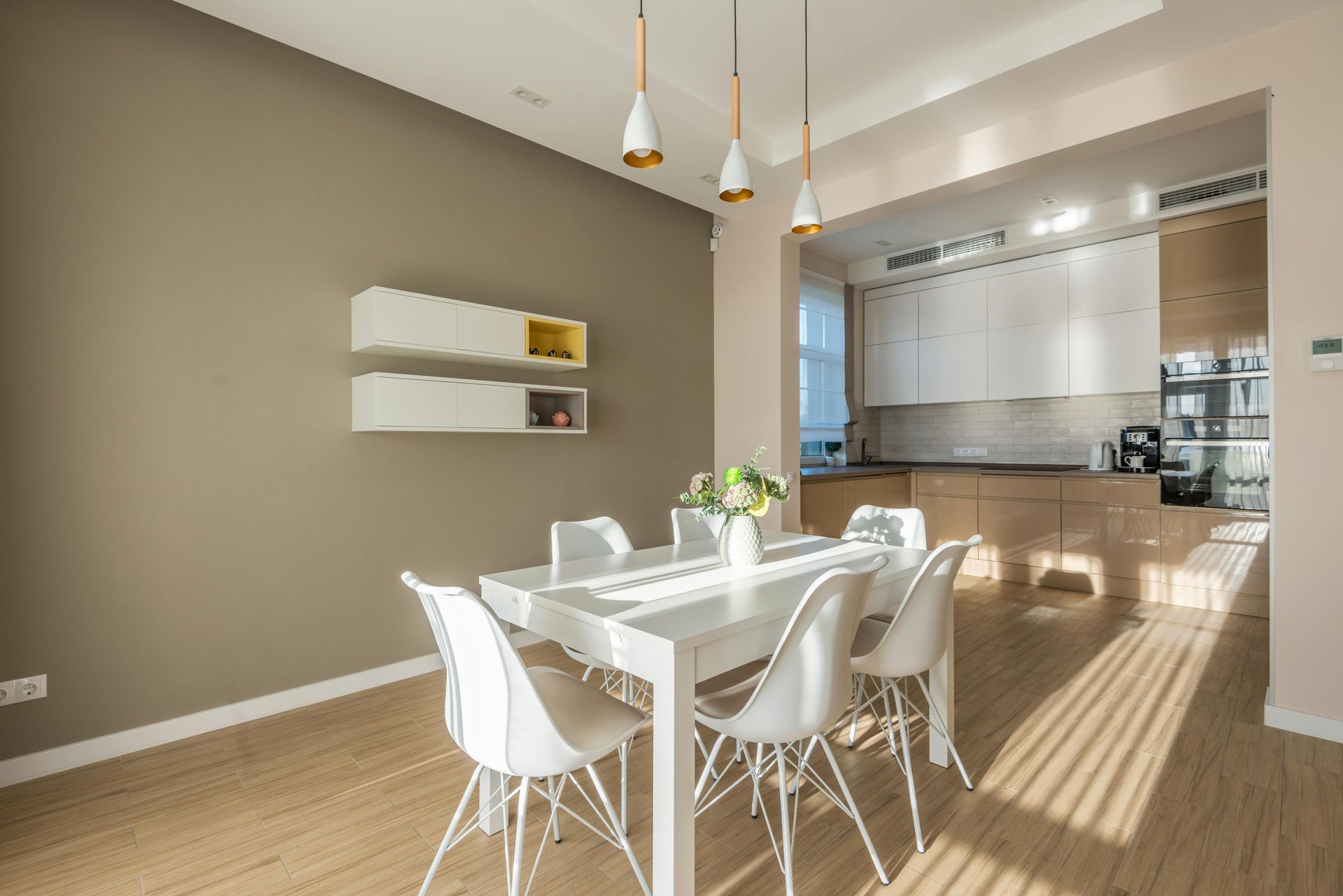 A modern living area with white dining table and chairs — Hart Projects Wollongong In Thirroul, NSW