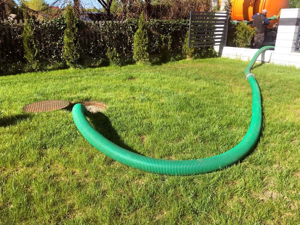 Green Garden Hose Stretched — Shreks Septic Services in Gowrie Junction, QLD