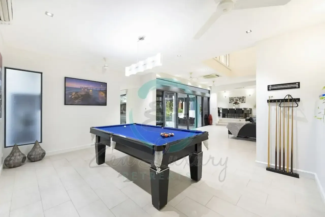 A Pool Table is in the Middle of a Living Room — Zen Luxury Retreats in Darwin City, NT