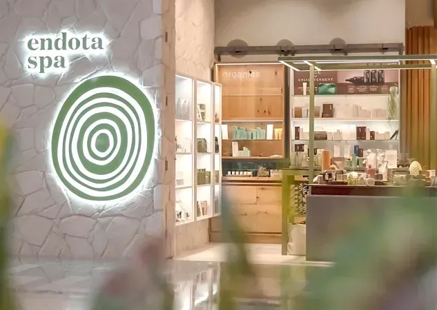 The inside of a spa with a green circle on the wall.
