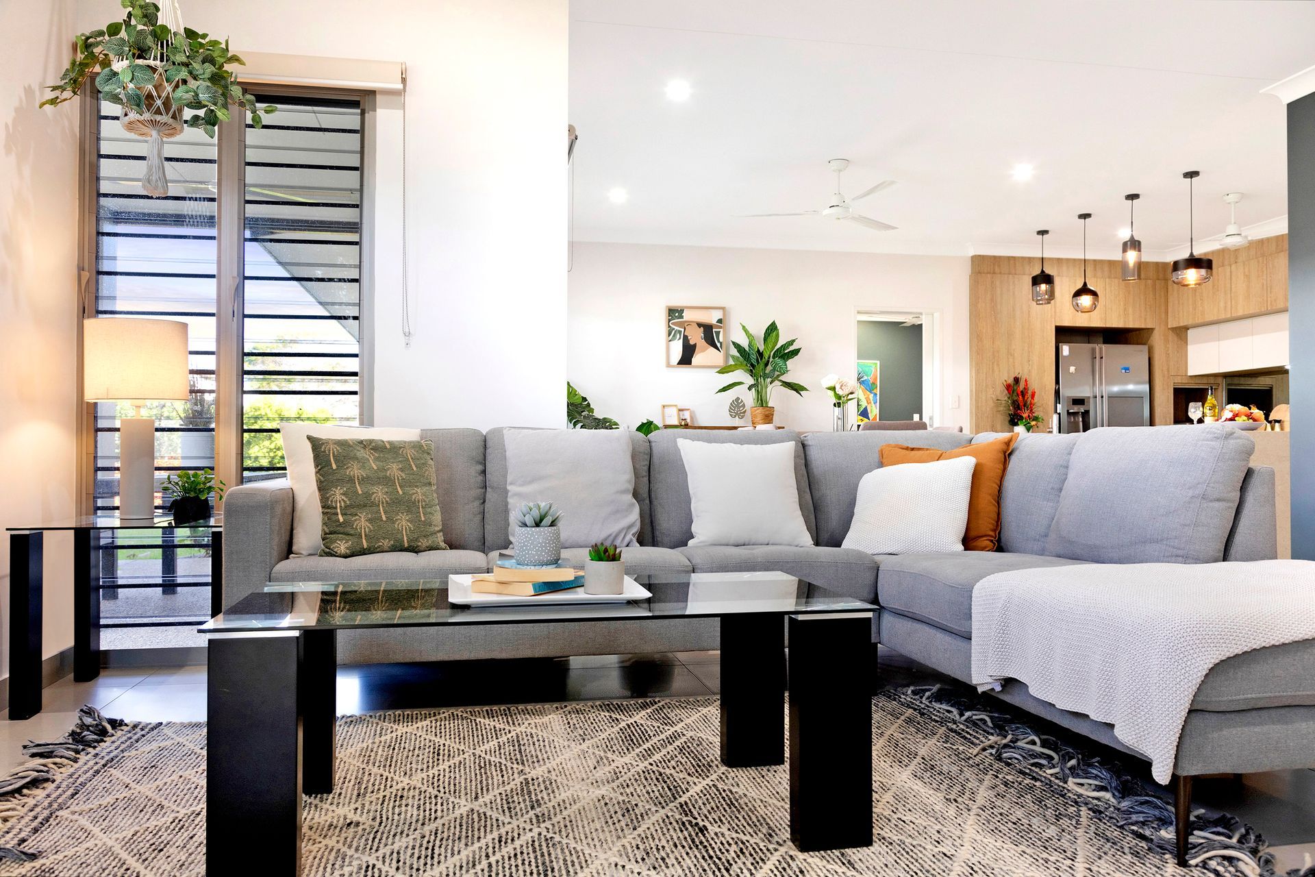A Living Room With a Couch, Coffee Table, and Rug — Zen Luxury Retreats in Darwin City, NT