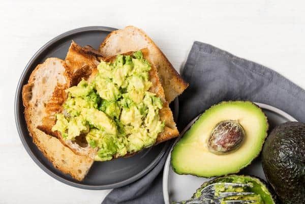 A Sandwich With Guacamole on It on a Plate — Zen Luxury Retreats in Darwin City, NT