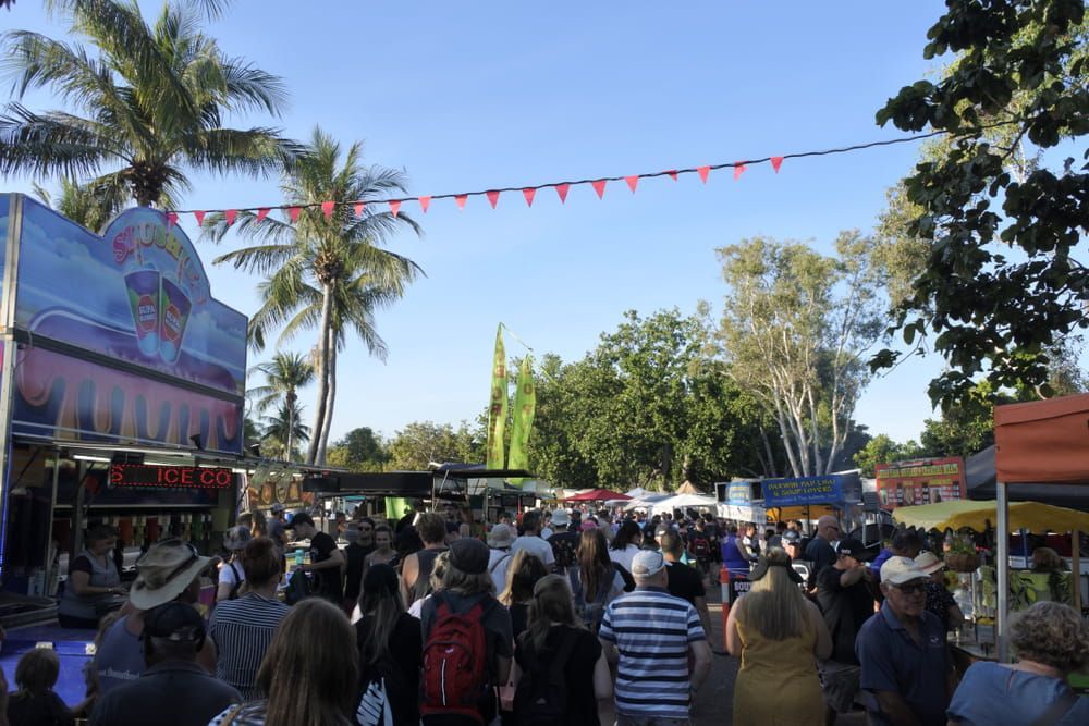 A Crowd of People Are Gathered at A Carnival — Zen Luxury Retreats in Darwin City, NT