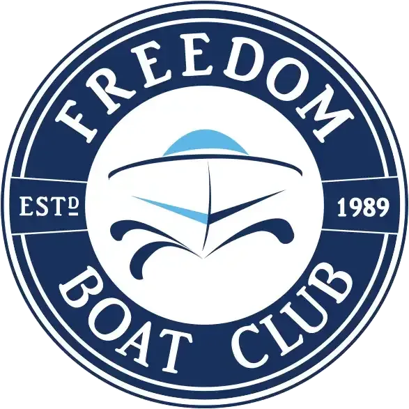 A blue and white logo for the freedom boat club.