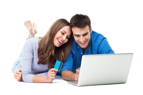 Couple paying bill online by laptop computer